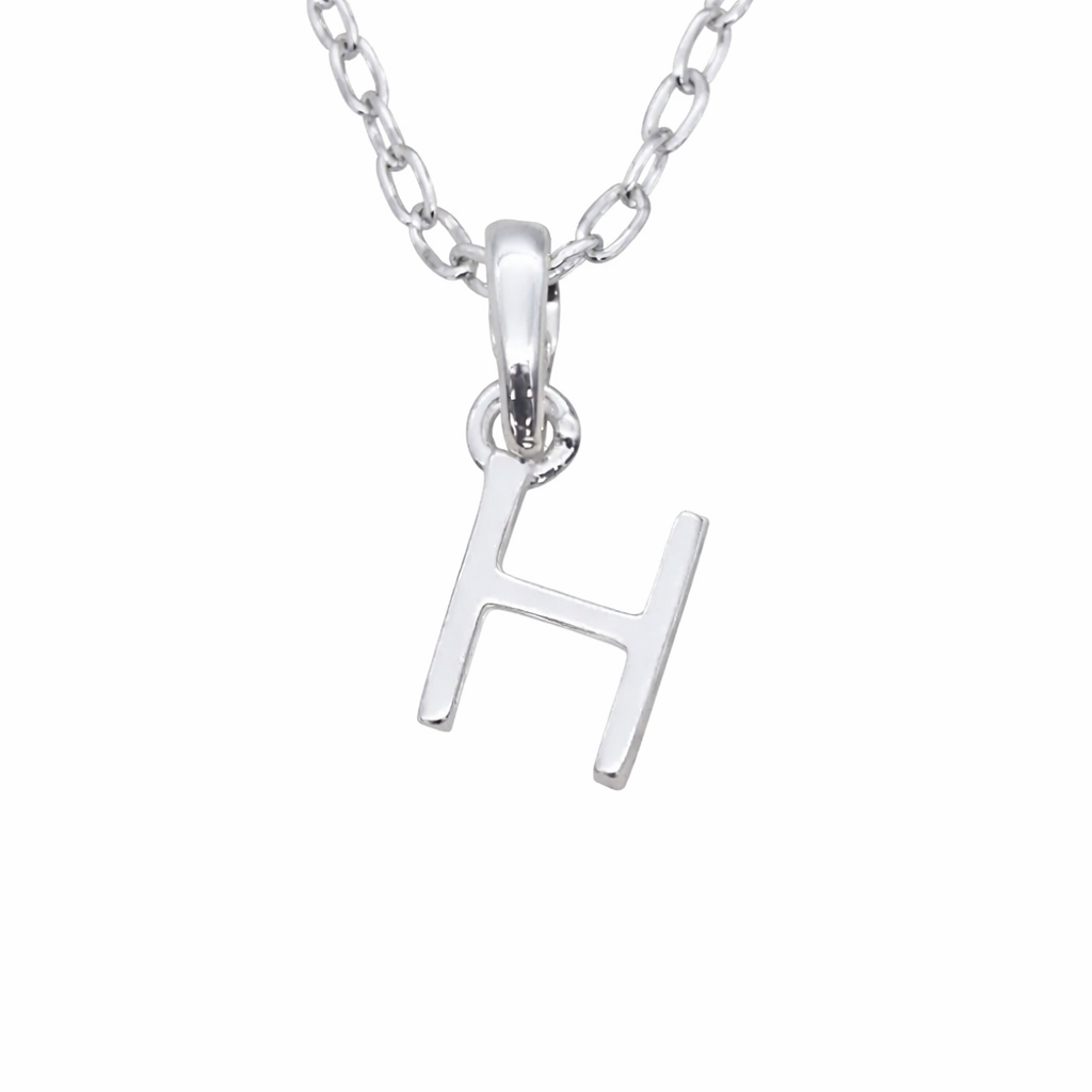 Indie and Harper Sterling Silver necklace with a 'H' initial pendant on a white background