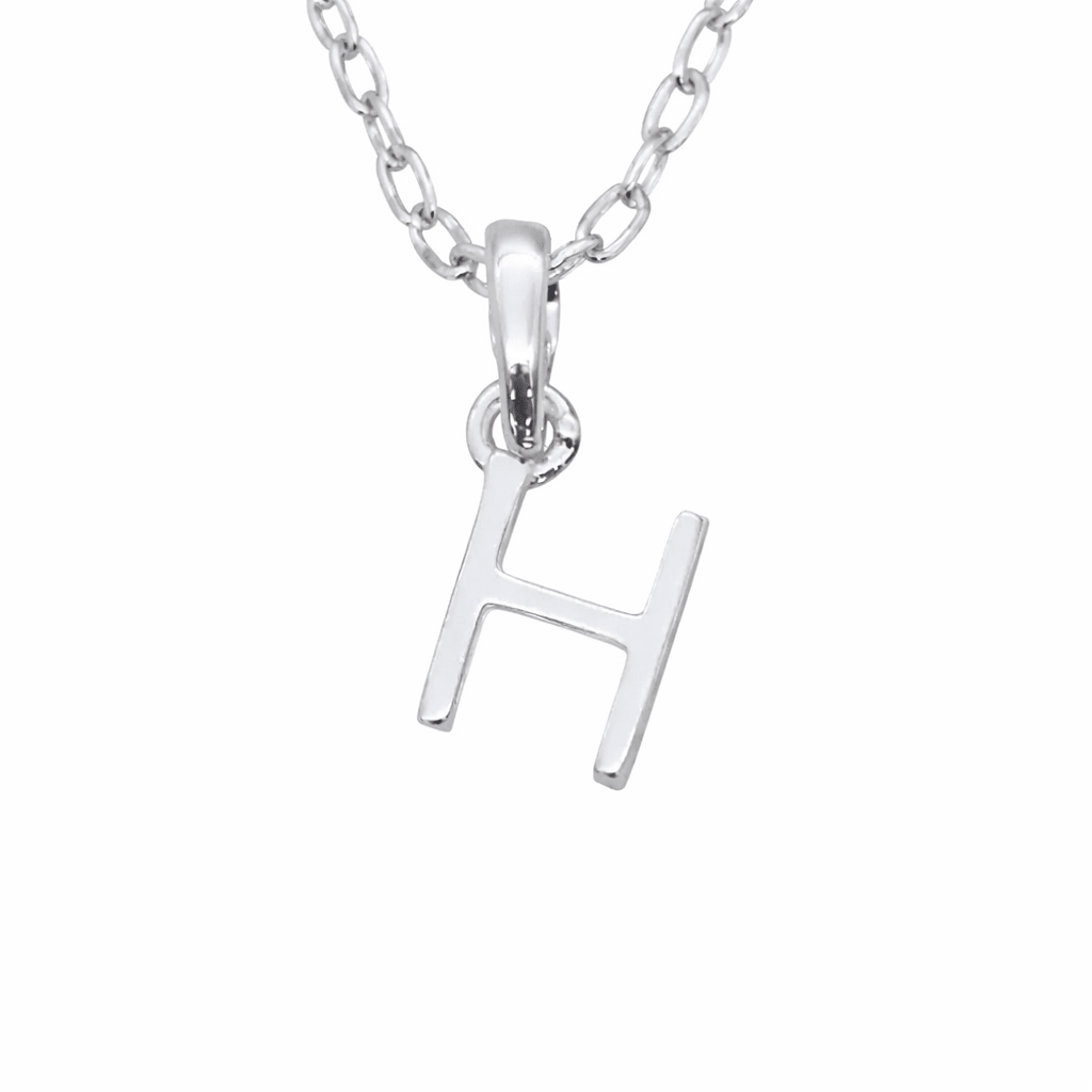 Indie and Harper Sterling Silver necklace with a 'H' initial pendant on a white background