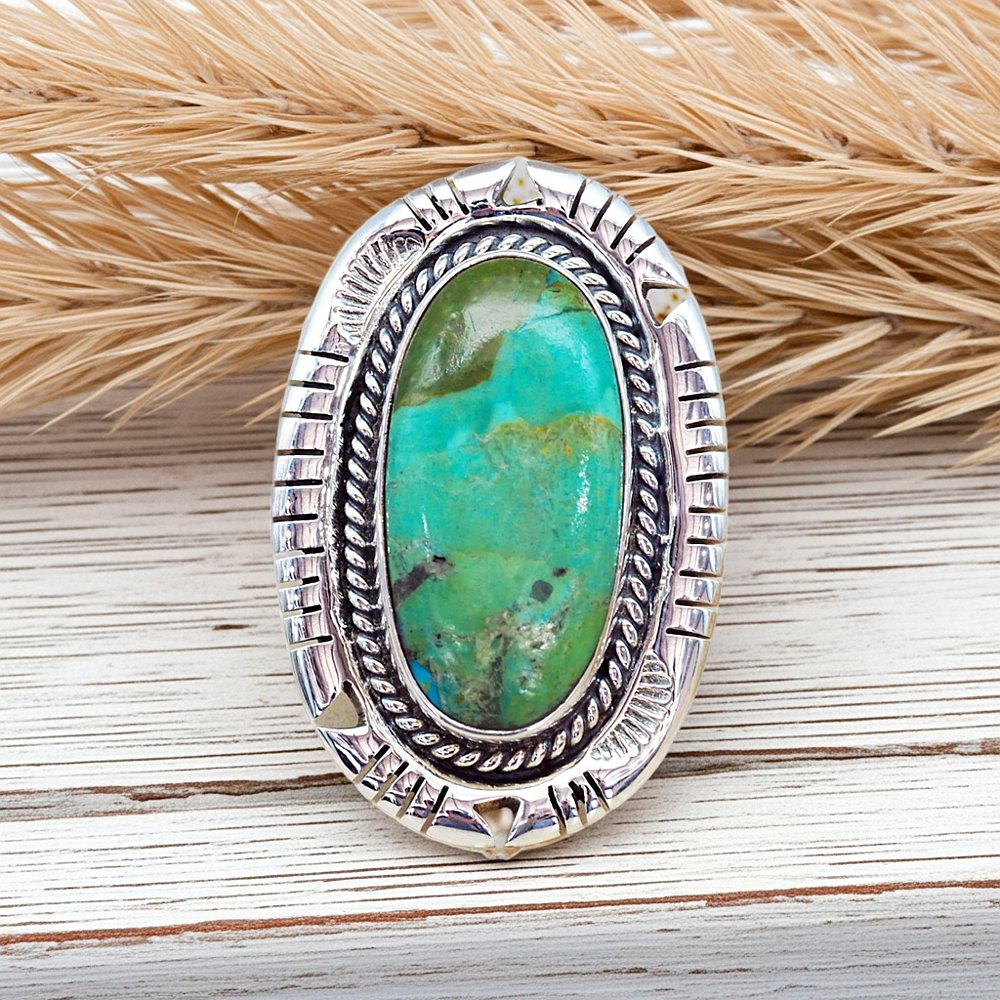 sterling silver turquoise ring on a wooden surface by indie and harper australia