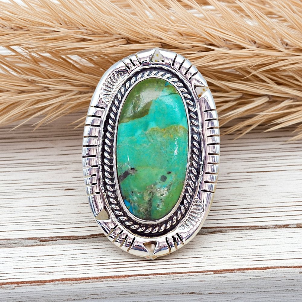 sterling silver turquoise ring on a wooden surface by indie and harper australia