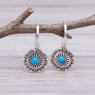 Sterling silver sleeper earrings with mandala pendants and a dainty turquoise stone 