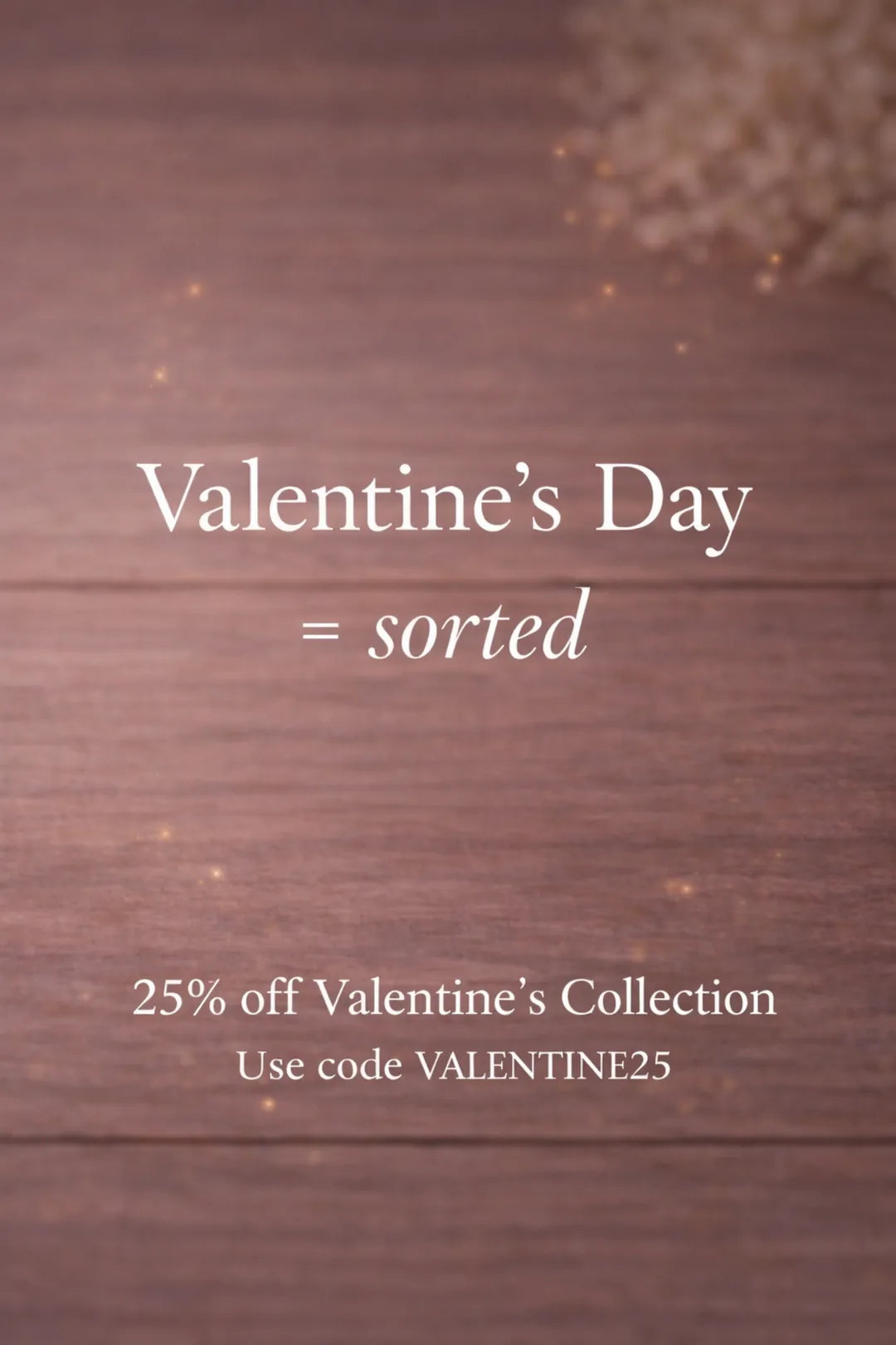 Promotional text for Valentine's Day sale on a wooden background