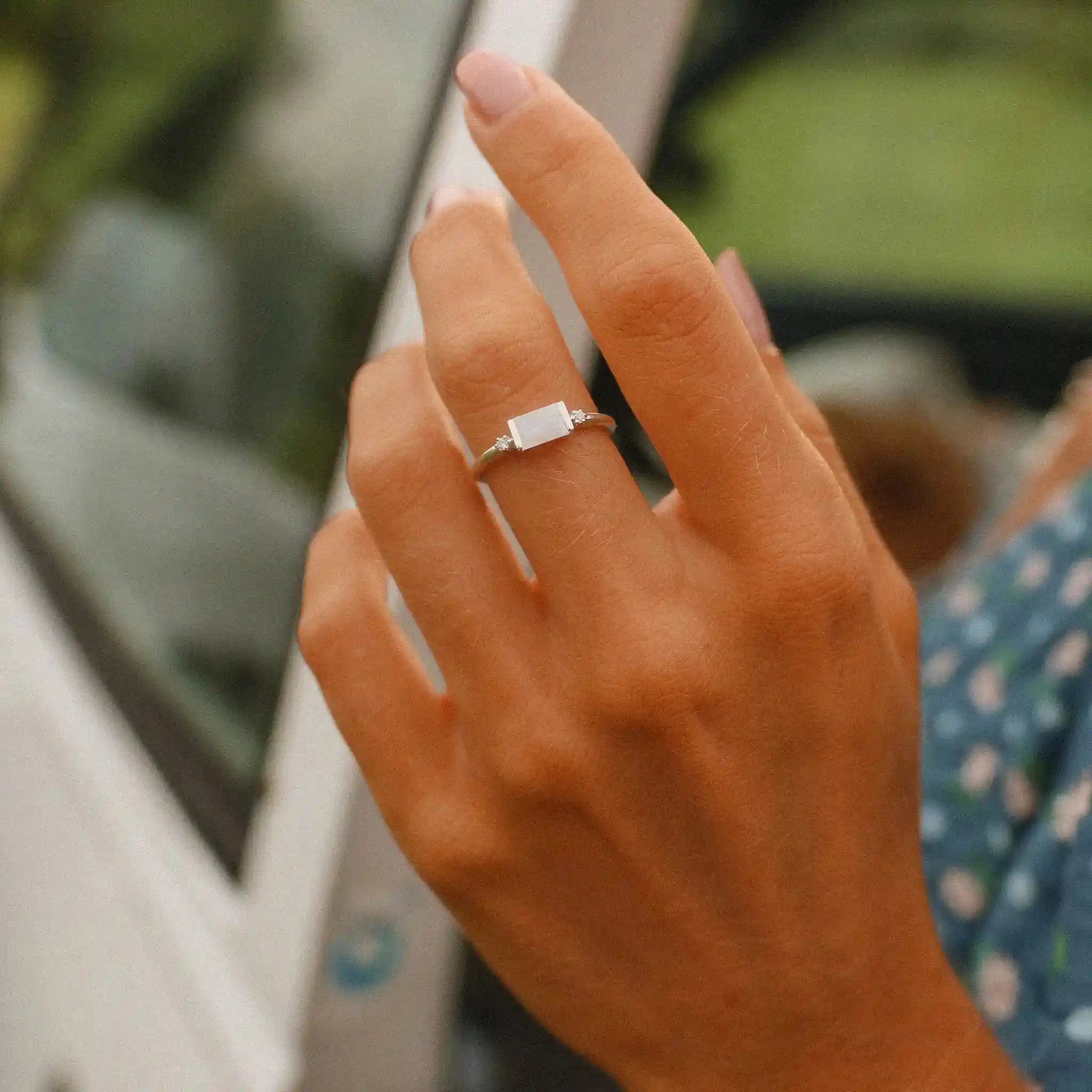 sterling silver white topaz and moonstone ring being worn