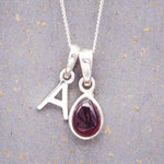 indie and harper sterling silver initial pendant and january birthstone garnet necklace