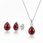 Sterling Silver Garnet jewellery set featuring a teardrop-shaped natural red garnet gemstone pendant necklace, matching stud garnet earrings on a clean white background.