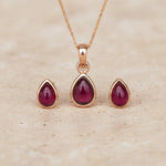 Rose Gold January Birthstone Garnet Jewellery Set including pear-shaped Garnet stud earrings and pendant necklace