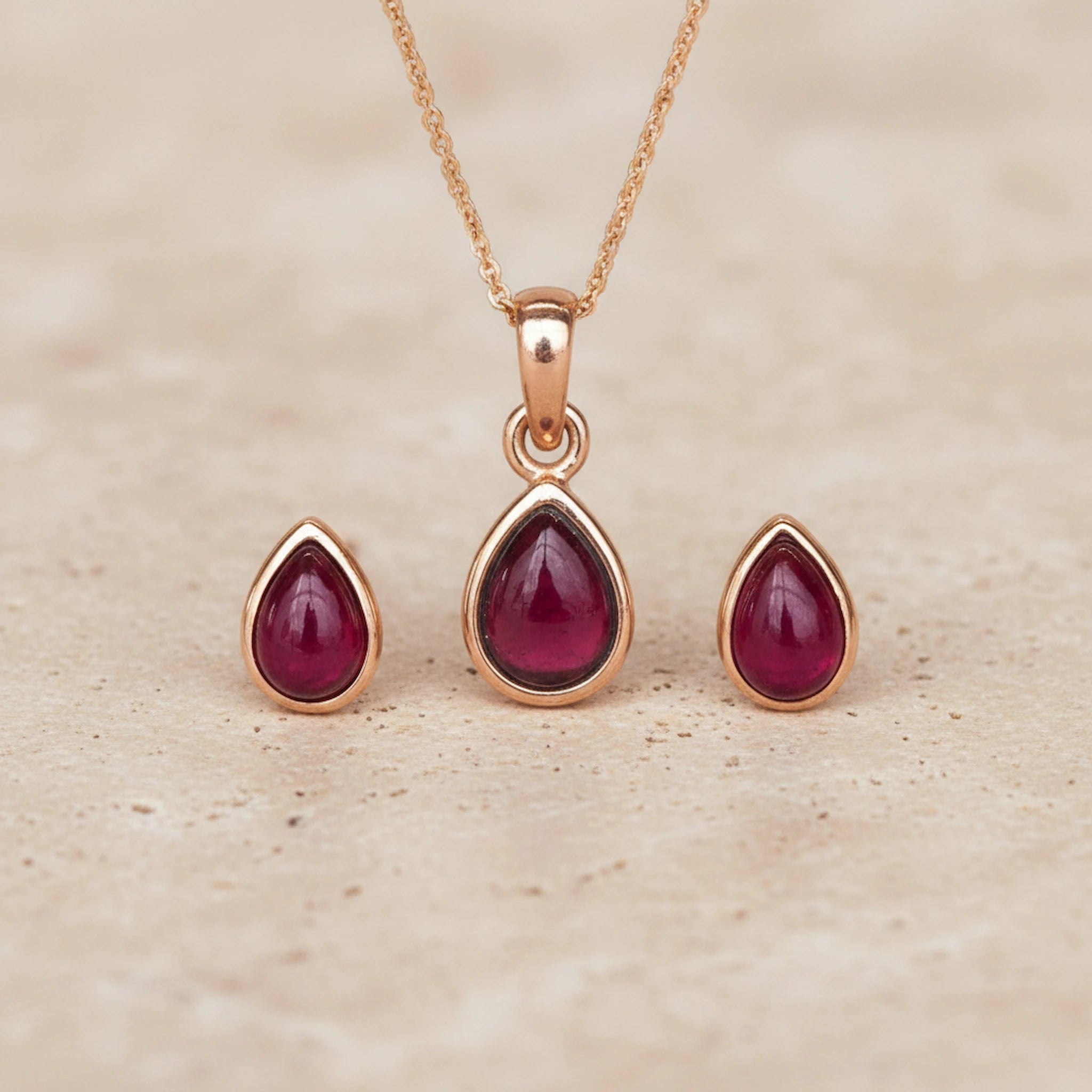Rose Gold January Birthstone Garnet Jewellery Set including pear-shaped Garnet stud earrings and pendant necklace