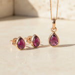 Rose Gold January Birthstone Garnet Jewellery Set including pear-shaped Garnet stud earrings and pendant necklace