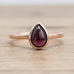 Rose gold January birthstone ring with pear-shaped natural garnet gemstone as a meaningful birthstone jewellery gift for her