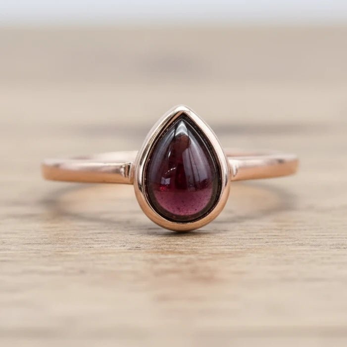 Rose gold January birthstone ring with pear-shaped natural garnet gemstone as a meaningful birthstone jewellery gift for her