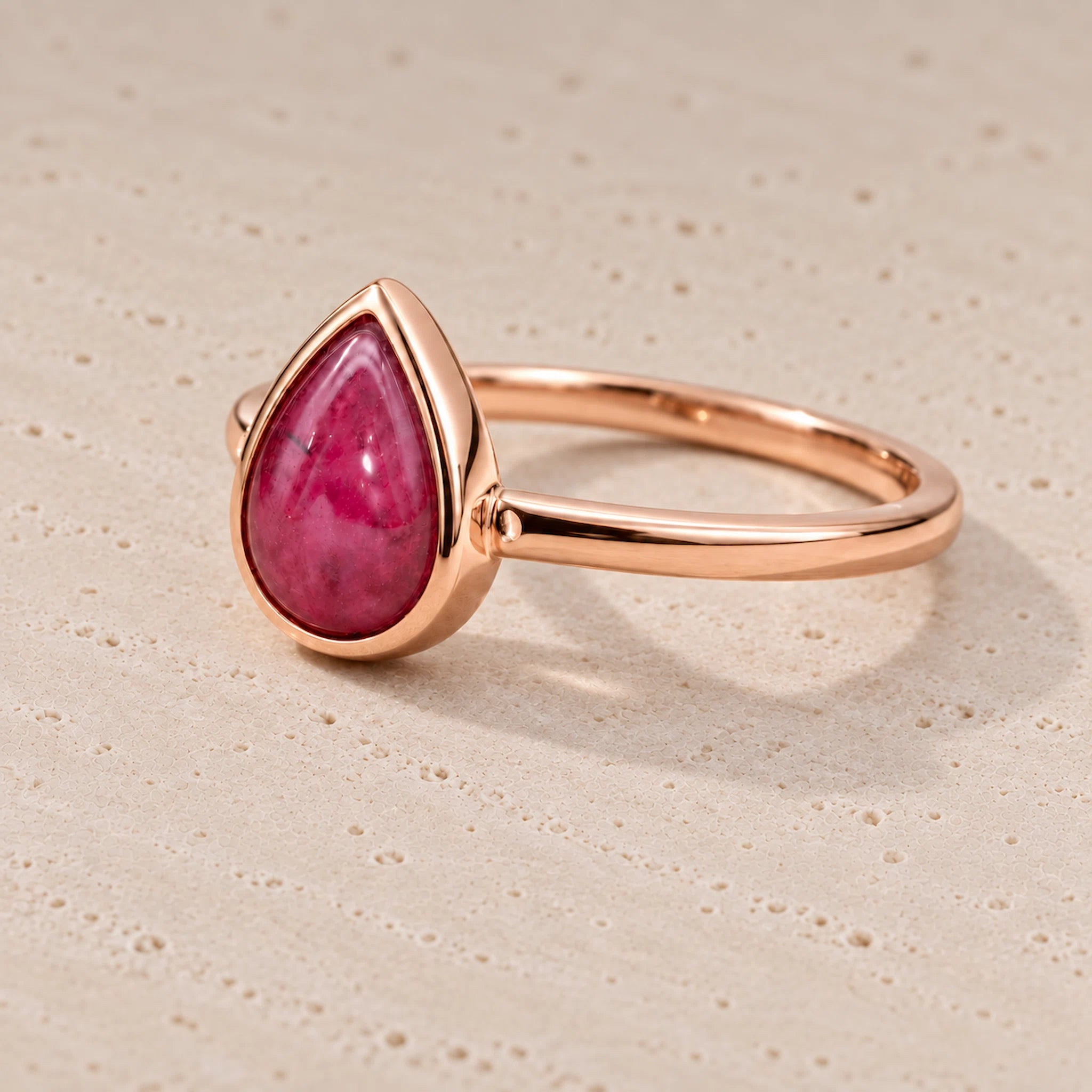Rose gold July birthstone Ring with pear-shaped natural ruby gemstone as a meaningful birthday jewellery gift for her.