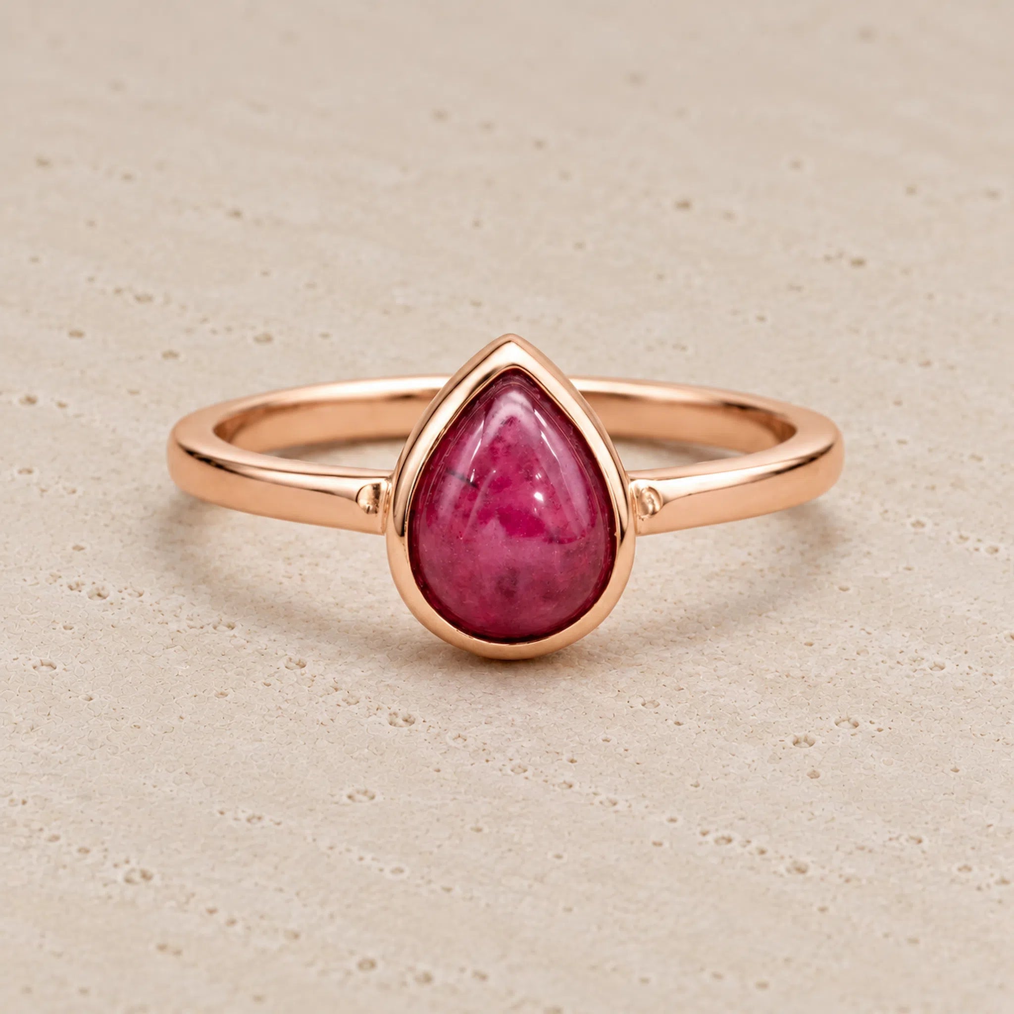 Rose gold July birthstone Ring with pear-shaped natural ruby gemstone as a meaningful birthday jewellery gift for her.