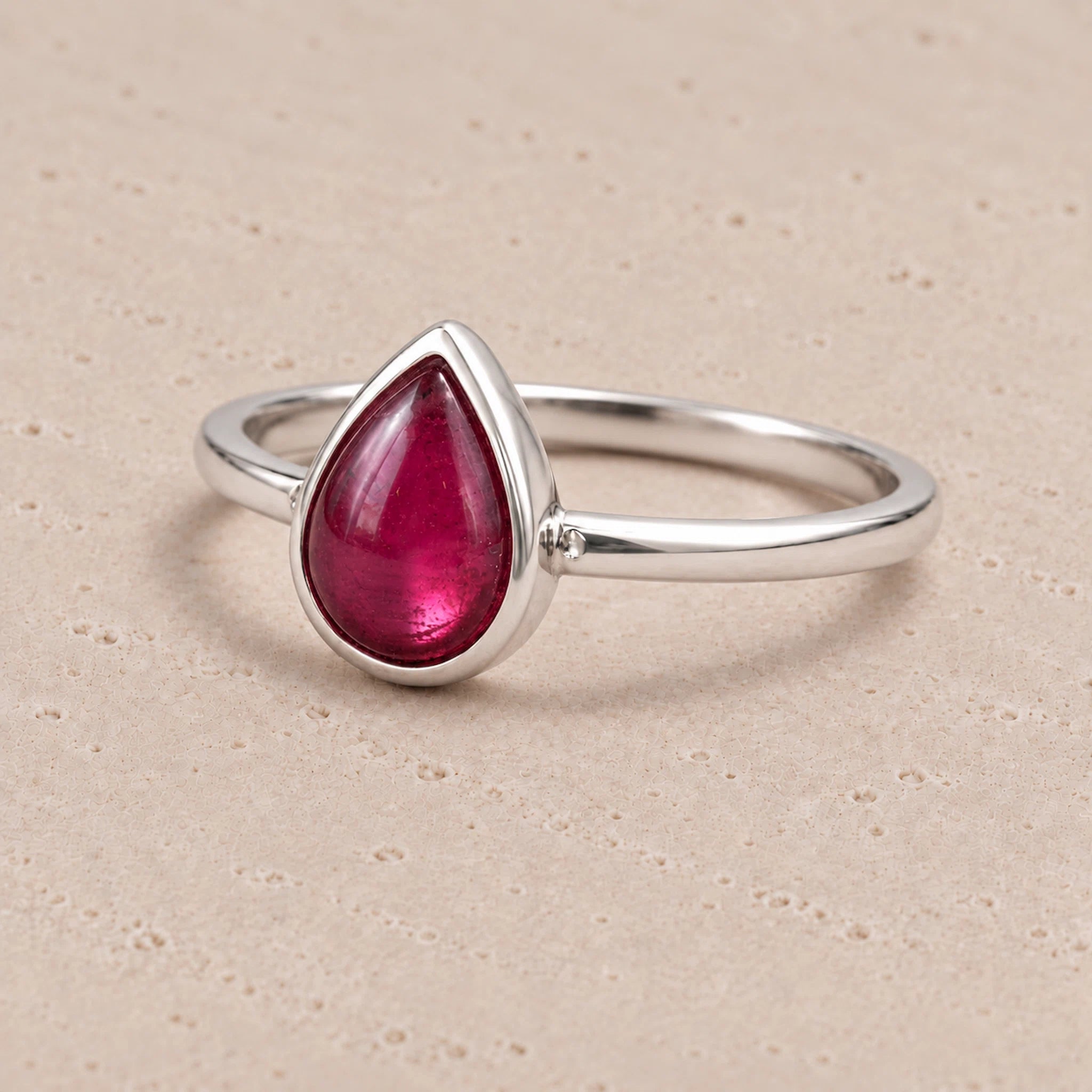 Sterling Silver July birthstone Ring with pear-shaped natural ruby gemstone as a meaningful birthday jewellery gift for her.