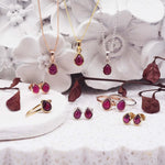 group shot of july birthstone jewellery including ruby necklaces, rings and earrings by indie and harper australia