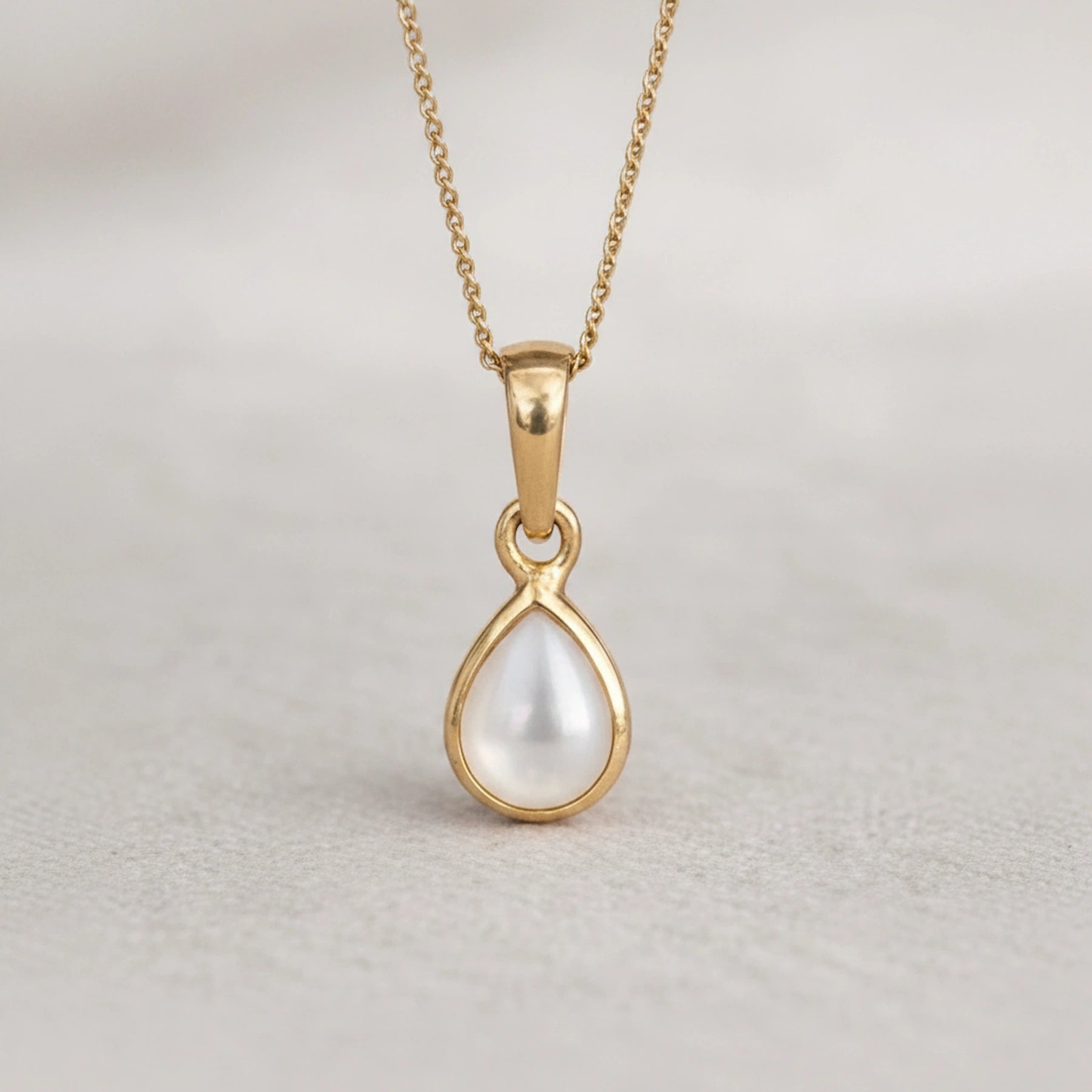 Gold June birthstone necklace with pear-shaped mother of pearl pendant - june birthday jewellery gift for her
