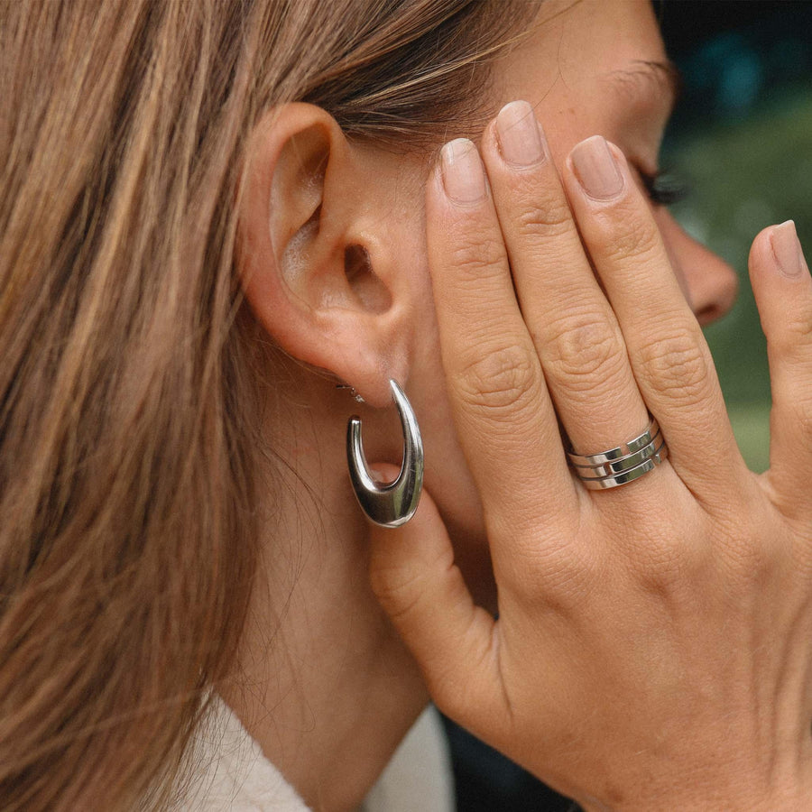 Woman wearing statement silver Hoop Earrings - womens silver jewellery Australia