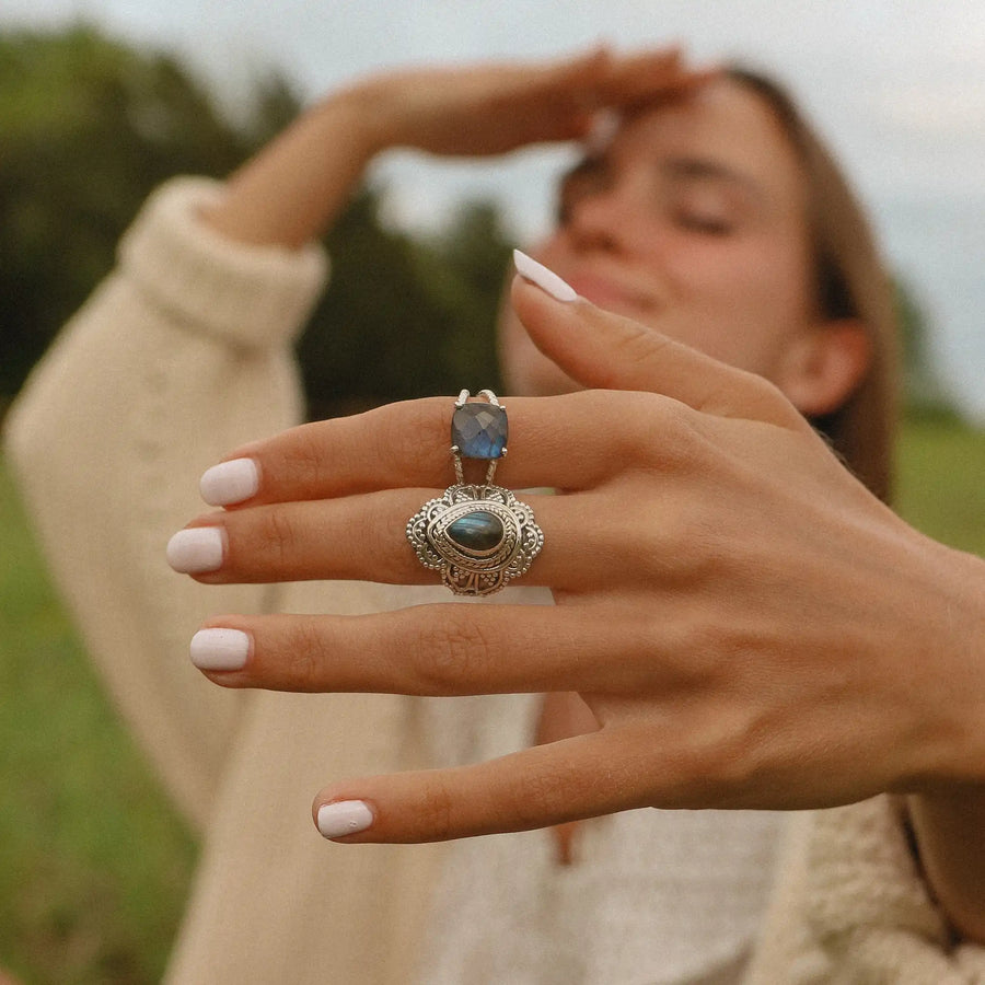 woman's hand close up showing her wearing two sterling silver rings with labradorite stones - boho jewellery Australia 