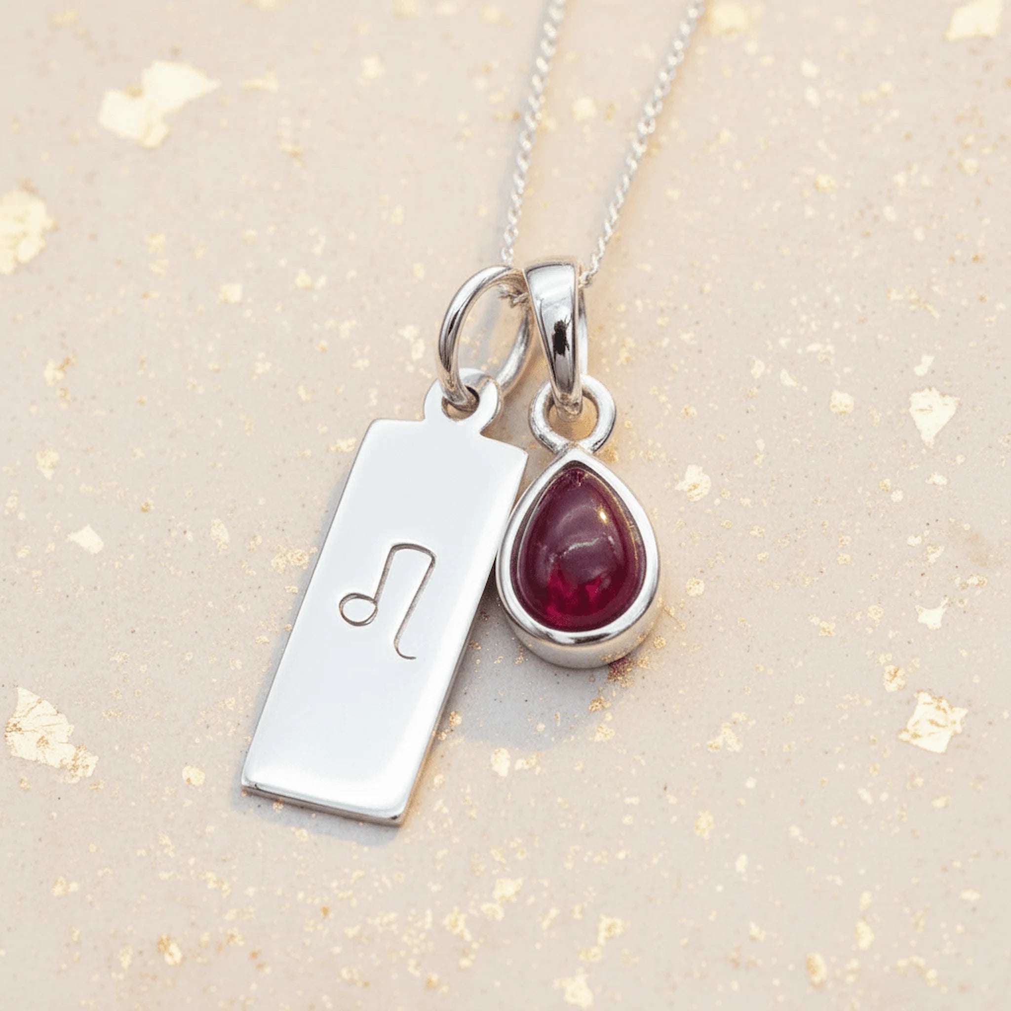 Sterling silver Leo Zodiac necklace with a July birthstone natural ruby gemstone pendant
