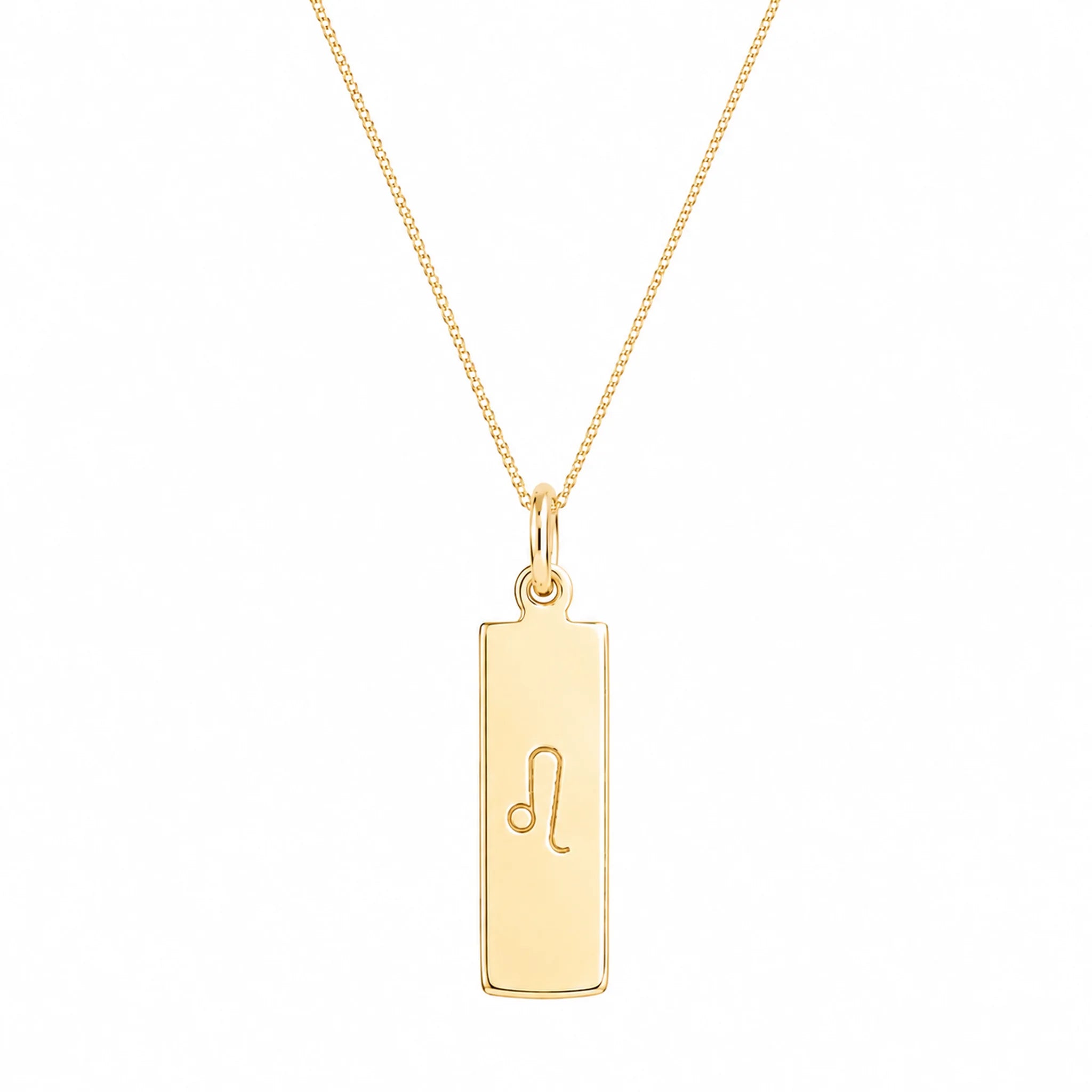A gold rectangular pendant necklace engraved with the Leo zodiac symbol, suspended from a delicate gold chain against a solid white background.