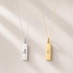 Leo Necklaces, one is silver and one in gold pendants, with rectangle pendants featuring minimalist engraved leo star sign zodiac line glyph symbols