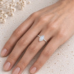 sterling silver rose cut bezel set marquise shaped natural moonstone ring being worn on a womens finger