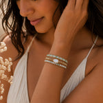 woman wearing a wrap bracelet with moonstones and beads