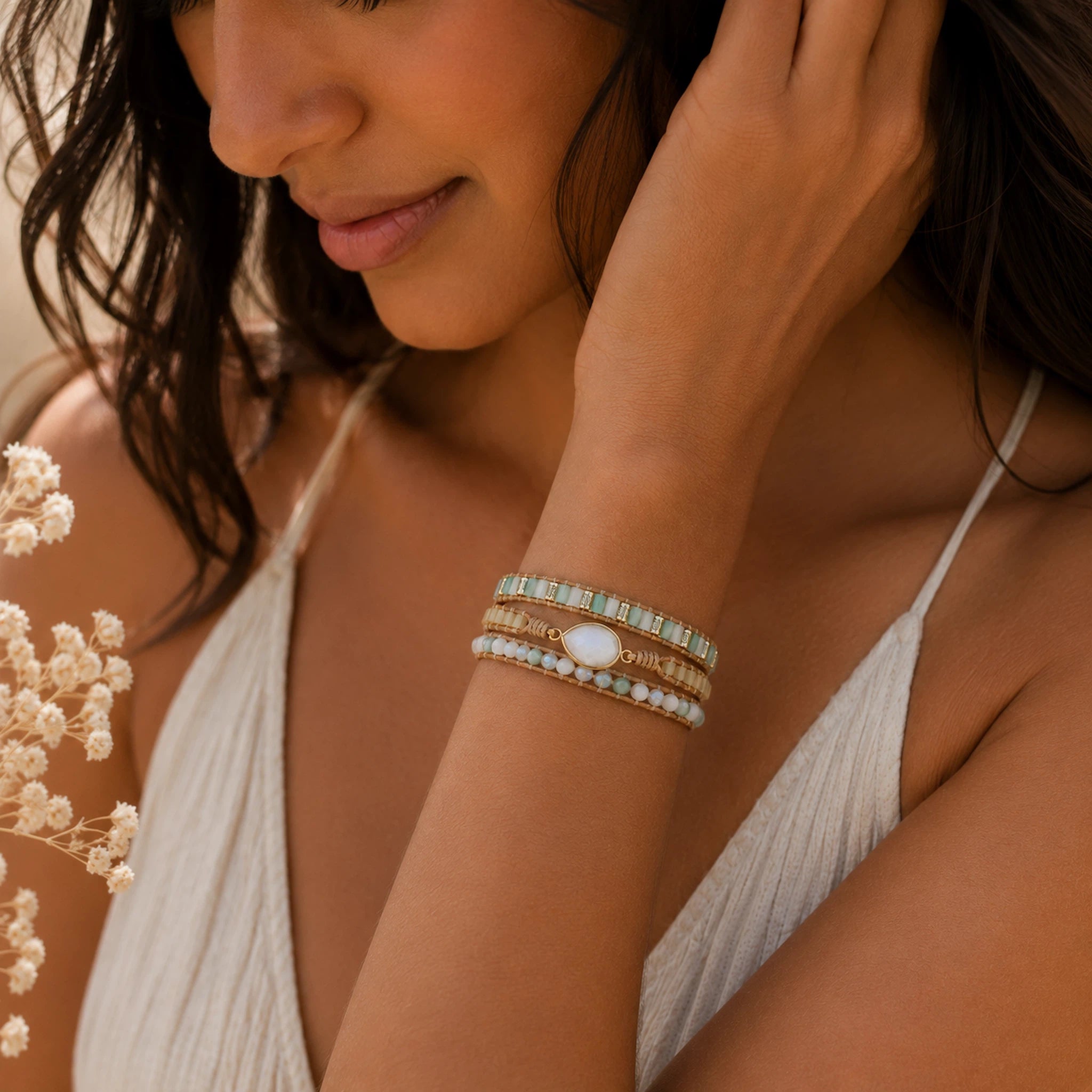 woman wearing a wrap bracelet with moonstones and beads
