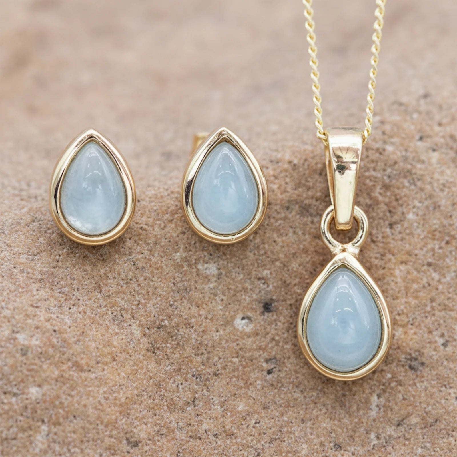 Gold March Birthstone Aquamarine Jewellery set including pear-shaped aquamarine earrings and aquamarine necklace