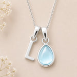 Sterling Silver March birthstone Necklace with a pear-shaped natural Aquamarine gemstone pendant and letter 'L' charm