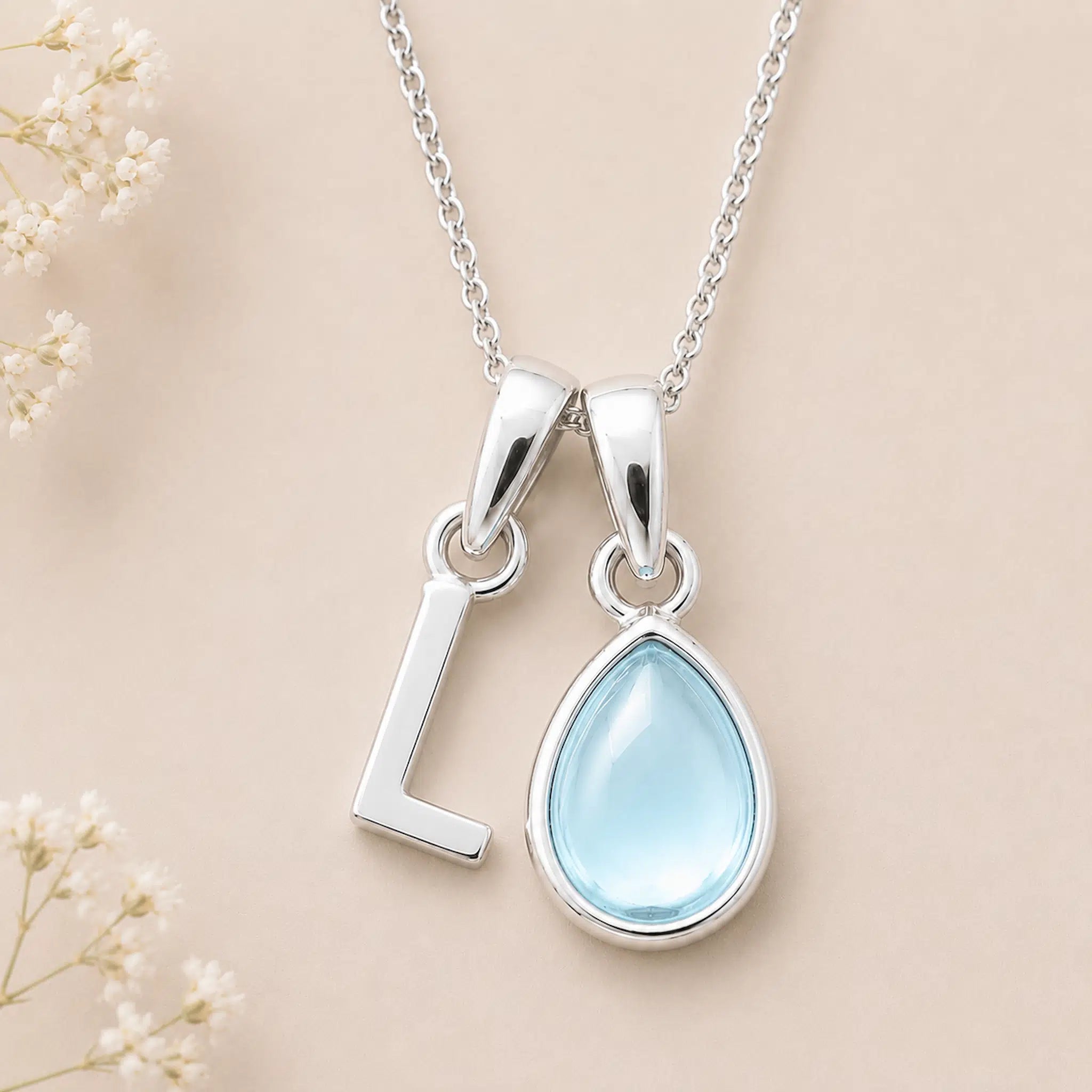 Sterling Silver March birthstone Necklace with a pear-shaped natural Aquamarine gemstone pendant and letter 'L' charm