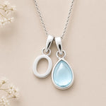 Sterling Silver March birthstone Necklace with a pear-shaped natural Aquamarine gemstone pendant and letter 'O' charm