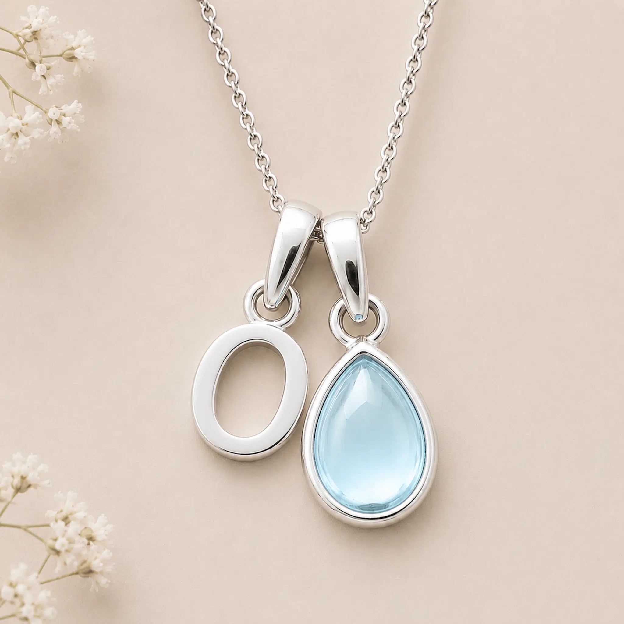 Sterling Silver March birthstone Necklace with a pear-shaped natural Aquamarine gemstone pendant and letter 'O' charm