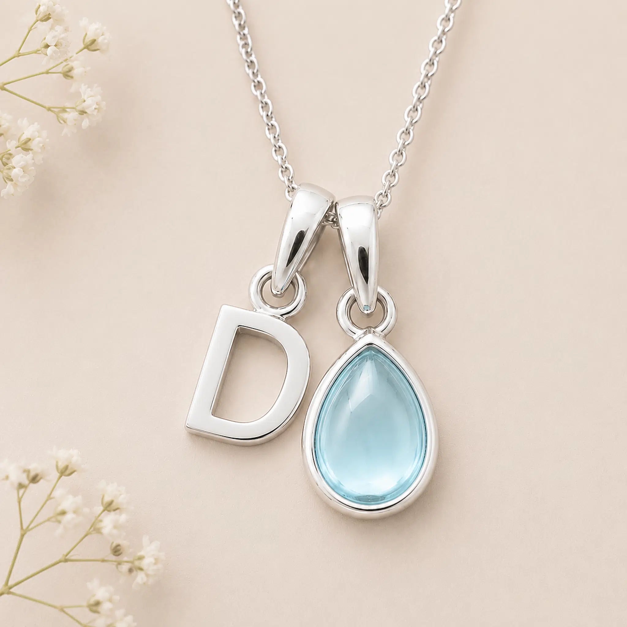 Sterling Silver March birthstone Necklace with a pear-shaped natural Aquamarine gemstone pendant and letter 'D' charm