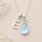 Sterling Silver March birthstone Necklace with a pear-shaped natural Aquamarine gemstone pendant and letter 'E' charm