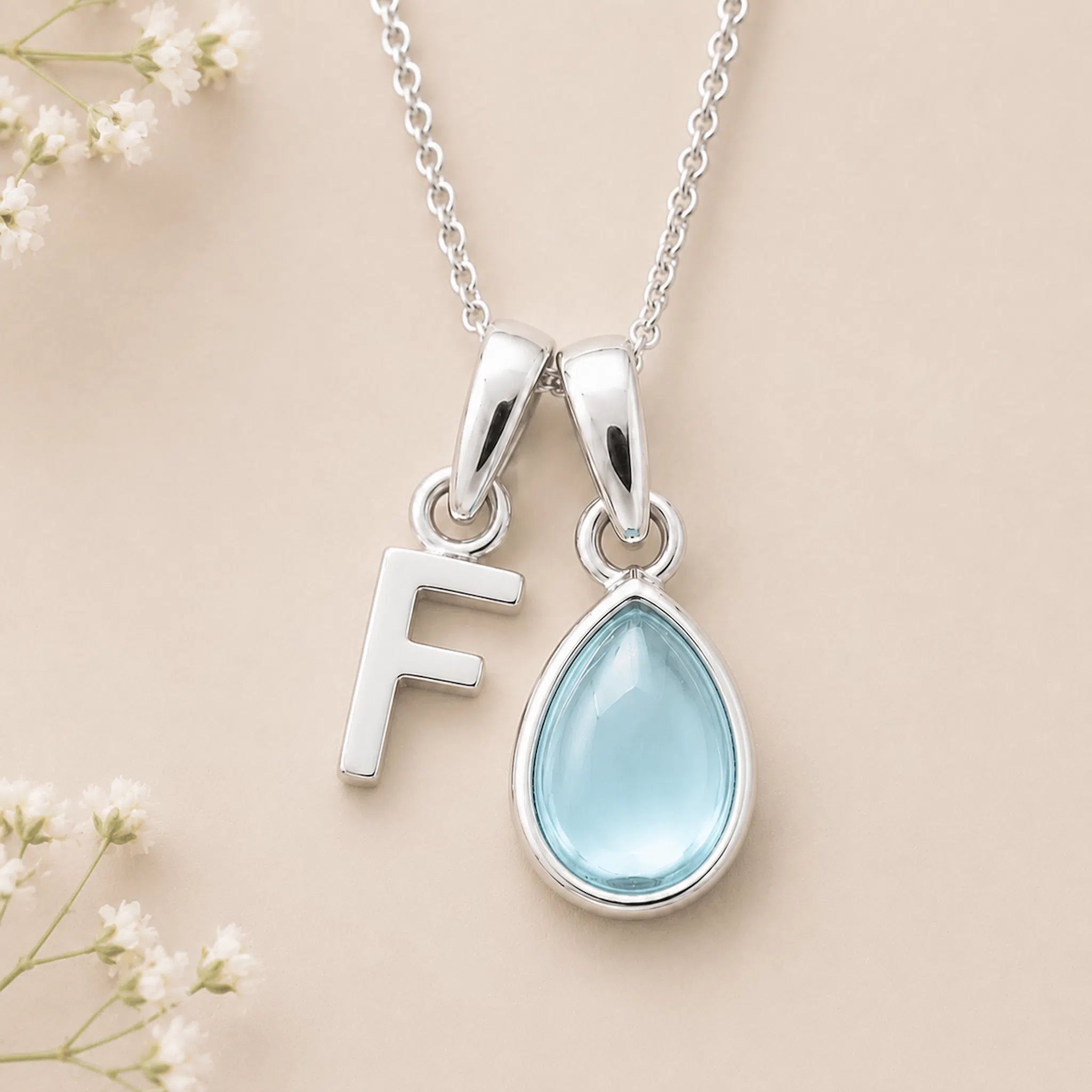 Sterling Silver March birthstone Necklace with a pear-shaped natural Aquamarine gemstone pendant and letter 'F' charm