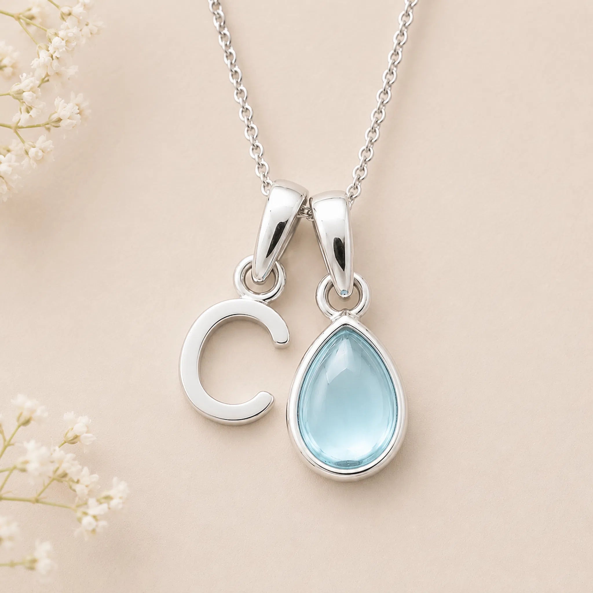 Sterling Silver March birthstone Necklace with a pear-shaped natural Aquamarine gemstone pendant and letter 'C' charm