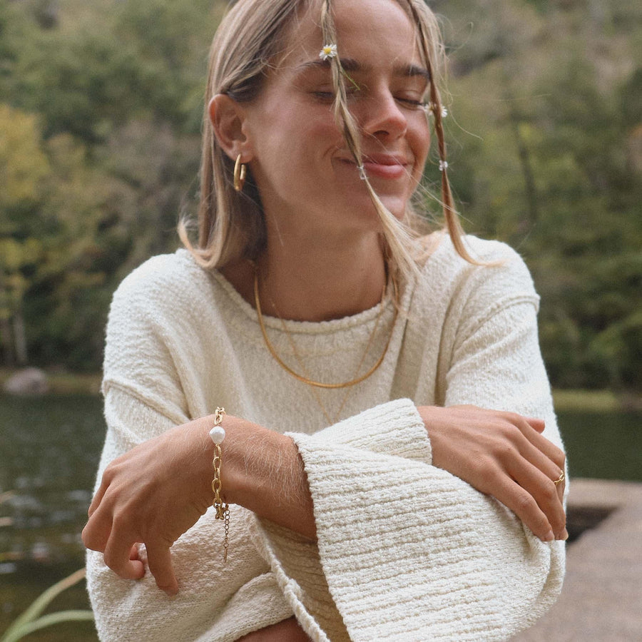 Smiling Woman wearing Gold Bracelet with freshwater pearl - womens gold waterproof jewellery - Australian jewellery brand