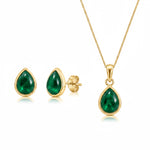 Gold May Birthstone Jewellery set featuring a pair of teardrop stud natural emerald earrings and matching natural emerald pendant necklace on a white background