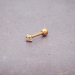 dainty gold single stud earring - made with synthetic white opal, gold plating over stainless steel and a ball back design by online jewellery brand indie and harper