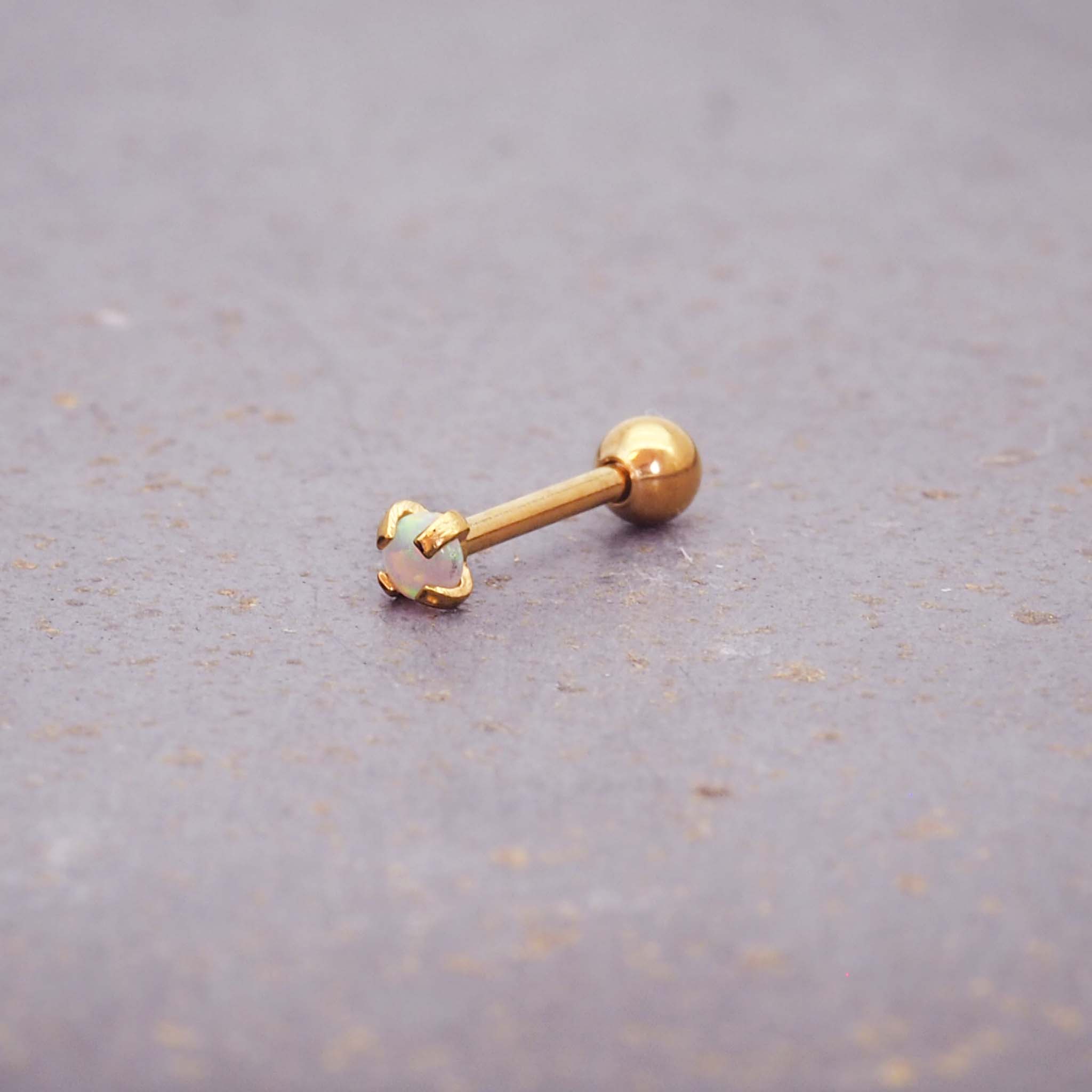dainty gold single stud earring - made with synthetic white opal, gold plating over stainless steel and a ball back design by online jewellery brand indie and harper