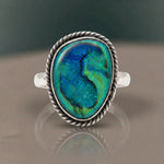 Monarch Opal Ring with a deep blue and teal opal in a sterling silver rope bezel, close-up