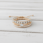 Multistrand beaded bracelet on a light wooden surface