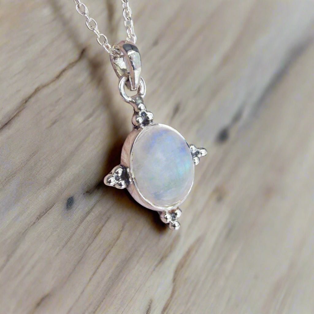 indie and harper sterling silver four points moonstone necklace being worn 