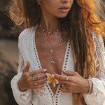 indie and harper sterling silver four points moonstone necklace being worn 