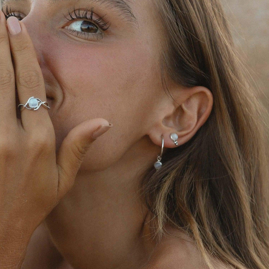 Woman with brown eyes wearing Moonstone Earrings - moonstone jewellery