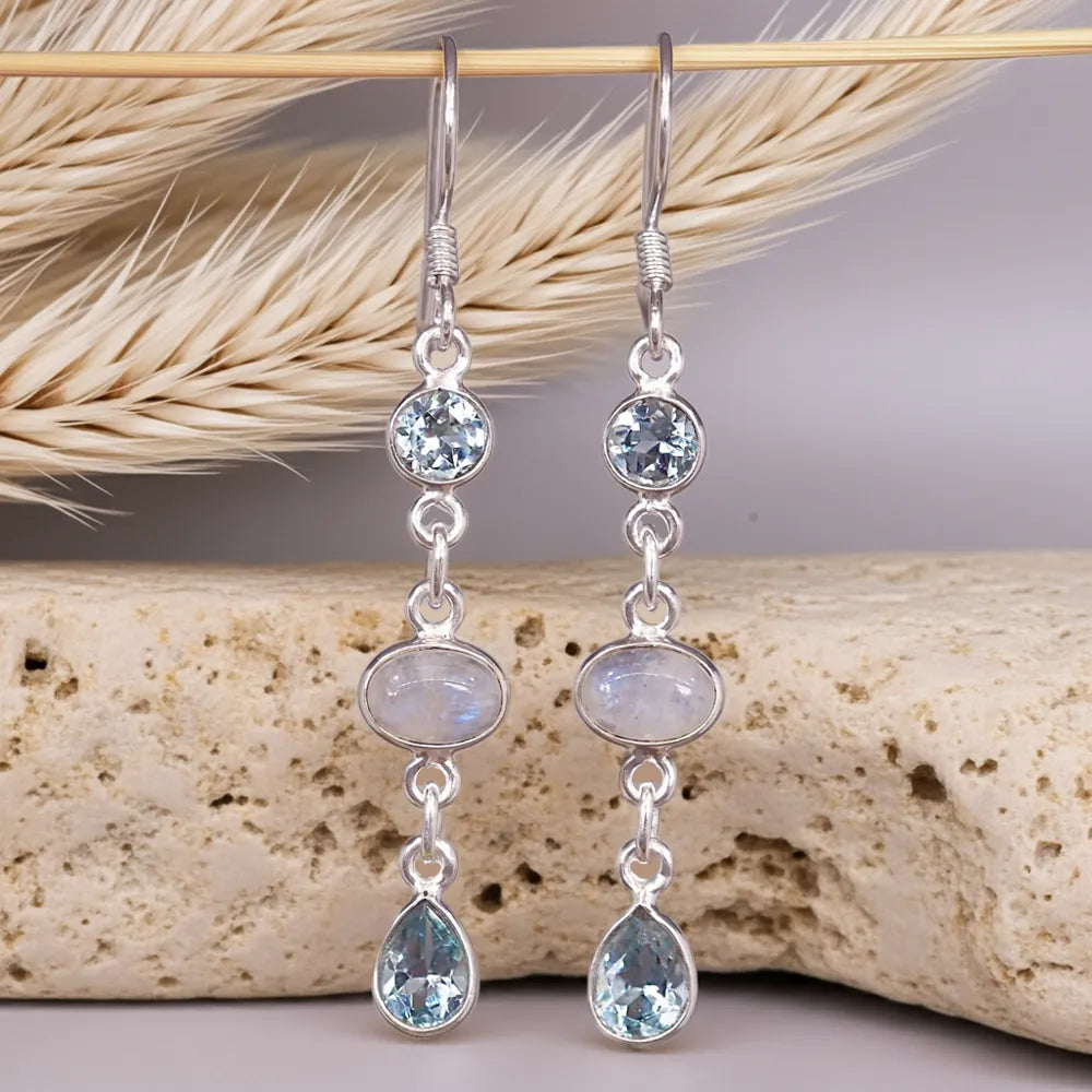 Sterling Silver earrings with Blue Topaz and Moonstone gemstones on a natural background by indie and harper australia