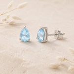 sterling silver facted claw-set pear-shaped natural blue topaz stud earrings