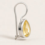 Side view of sterling silver natural citrine teardrop hook earring