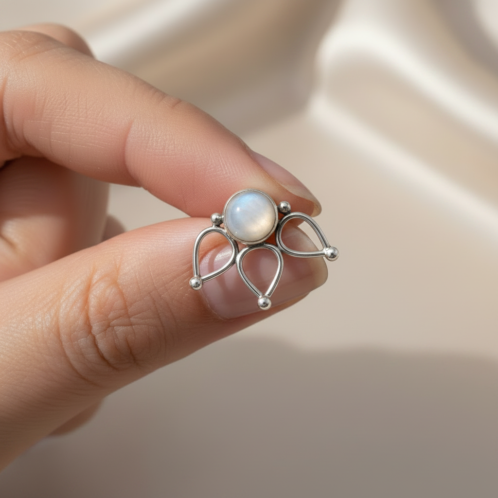 Moonstone stud earring held