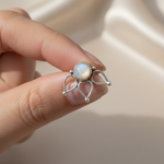 Moonstone stud earring held